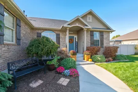 Nicely mulched garden bed and well maintained shrubs and flowers